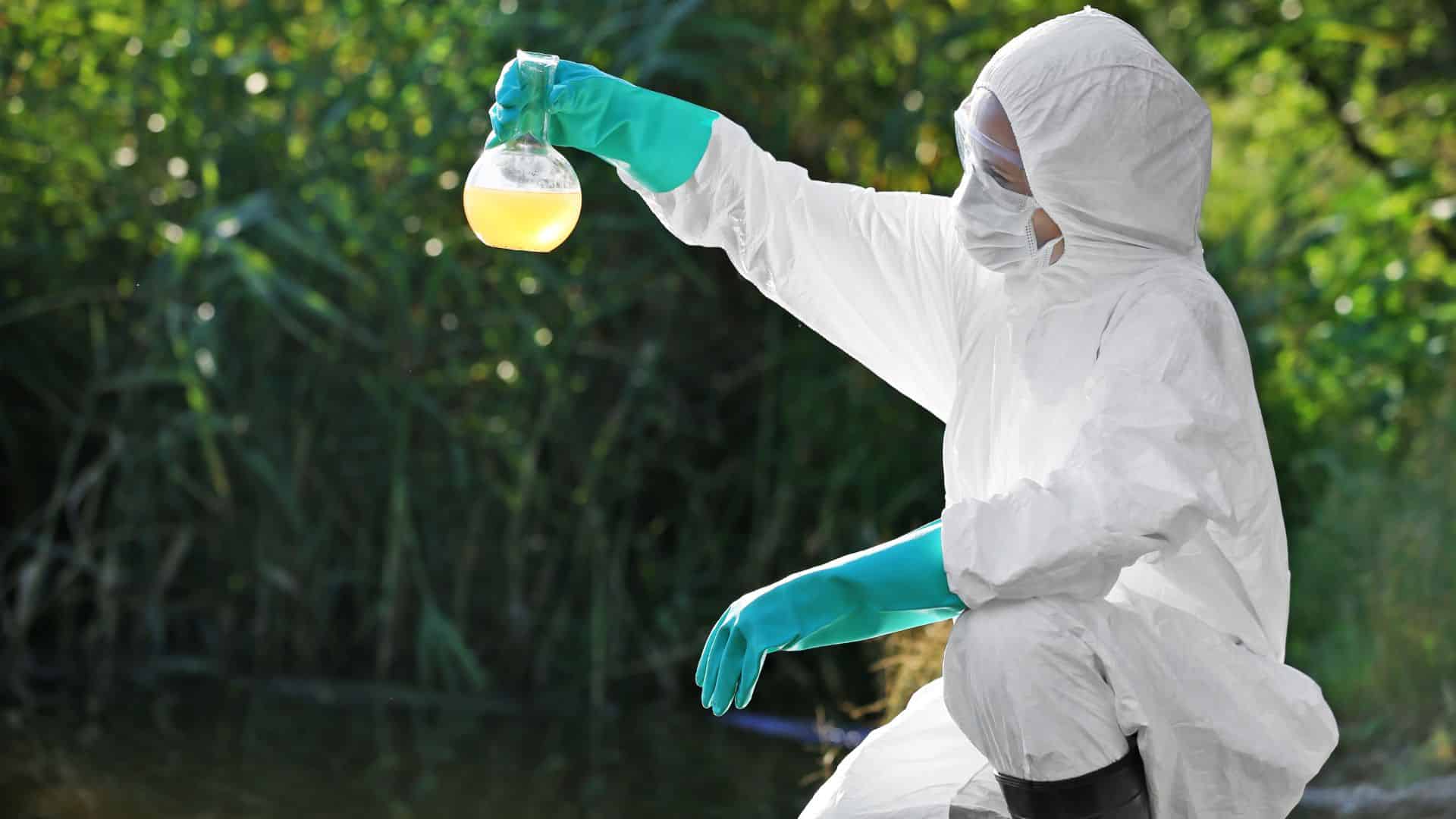 Female scientist taking water samples